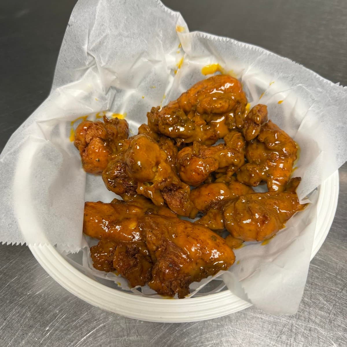Boneless Wings — Choose six or twelve boneless wings, a sauce and ranch or blue cheese dip