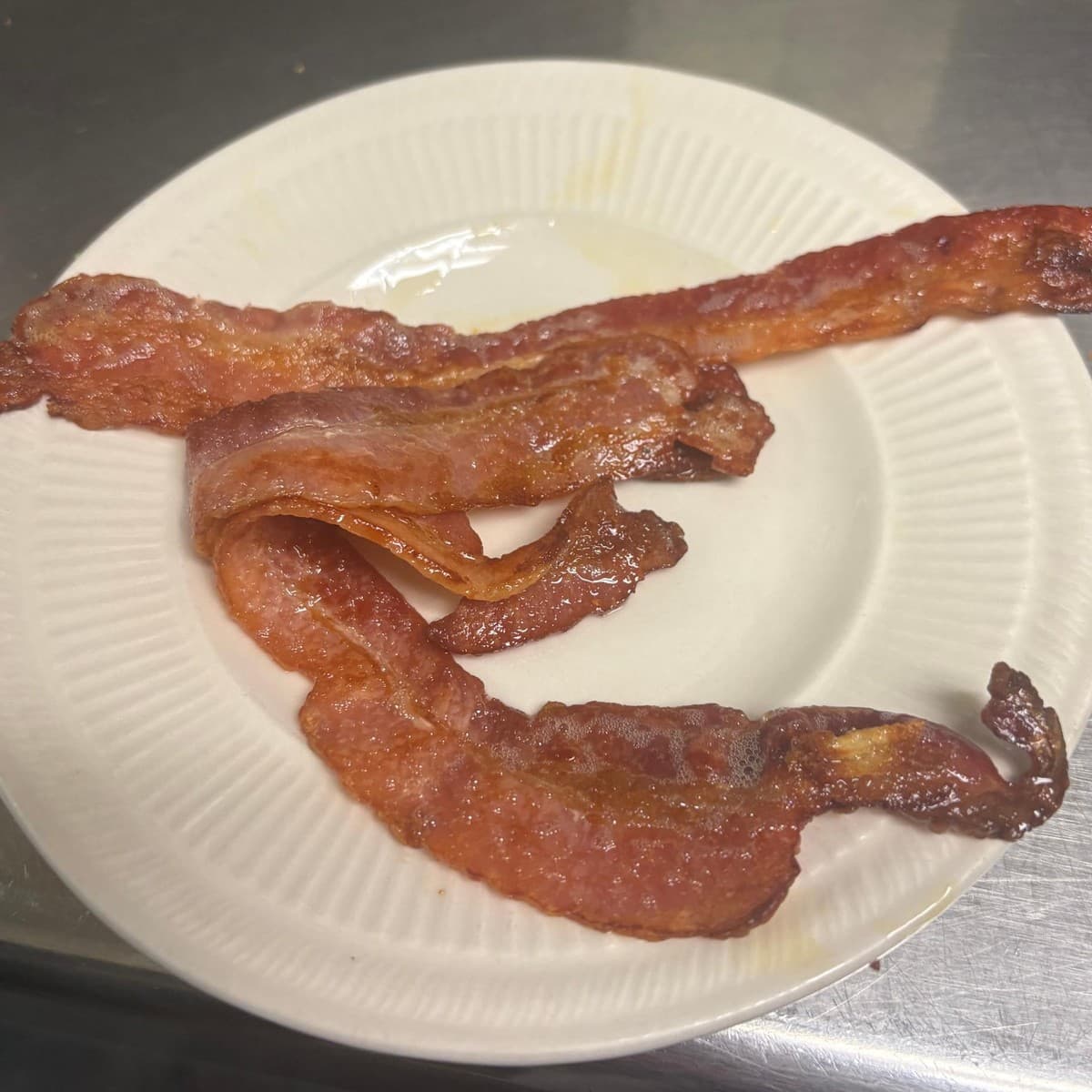 Side of Bacon — Three pieces of bacon, with your preferred doneness available