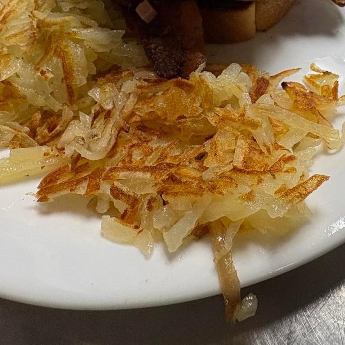 Side of Shredded Hashbrowns — Shredded hashbrowns with a choice of doneness