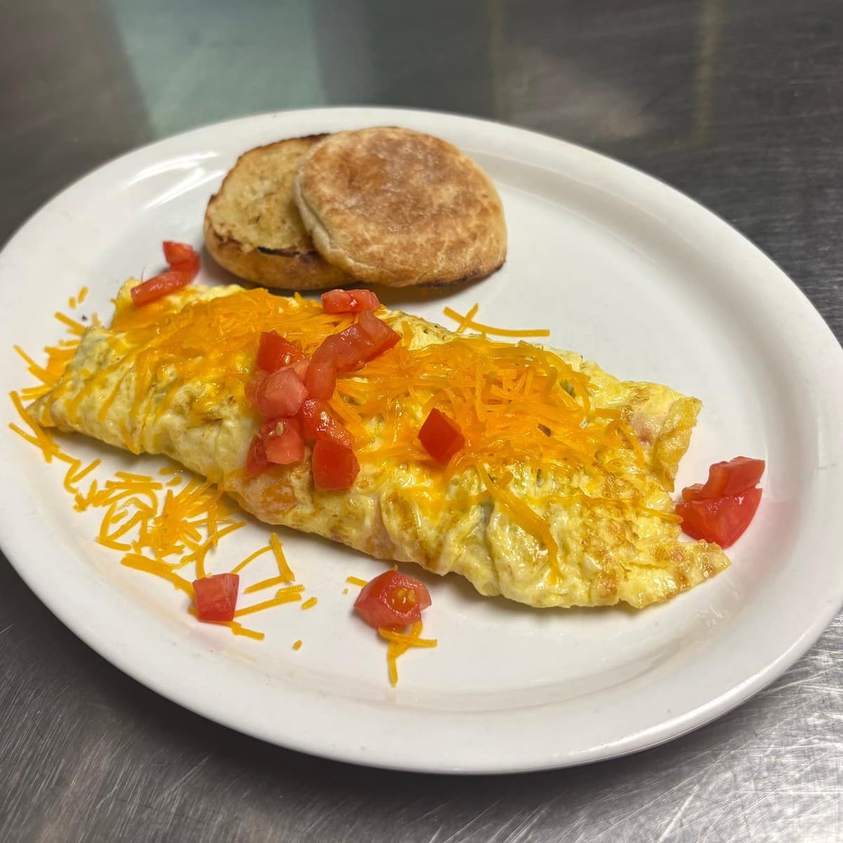 Veggie Omelet — An omelet with peppers, mushrooms, onions and tomatoes, plus your choice of cheese and toast
